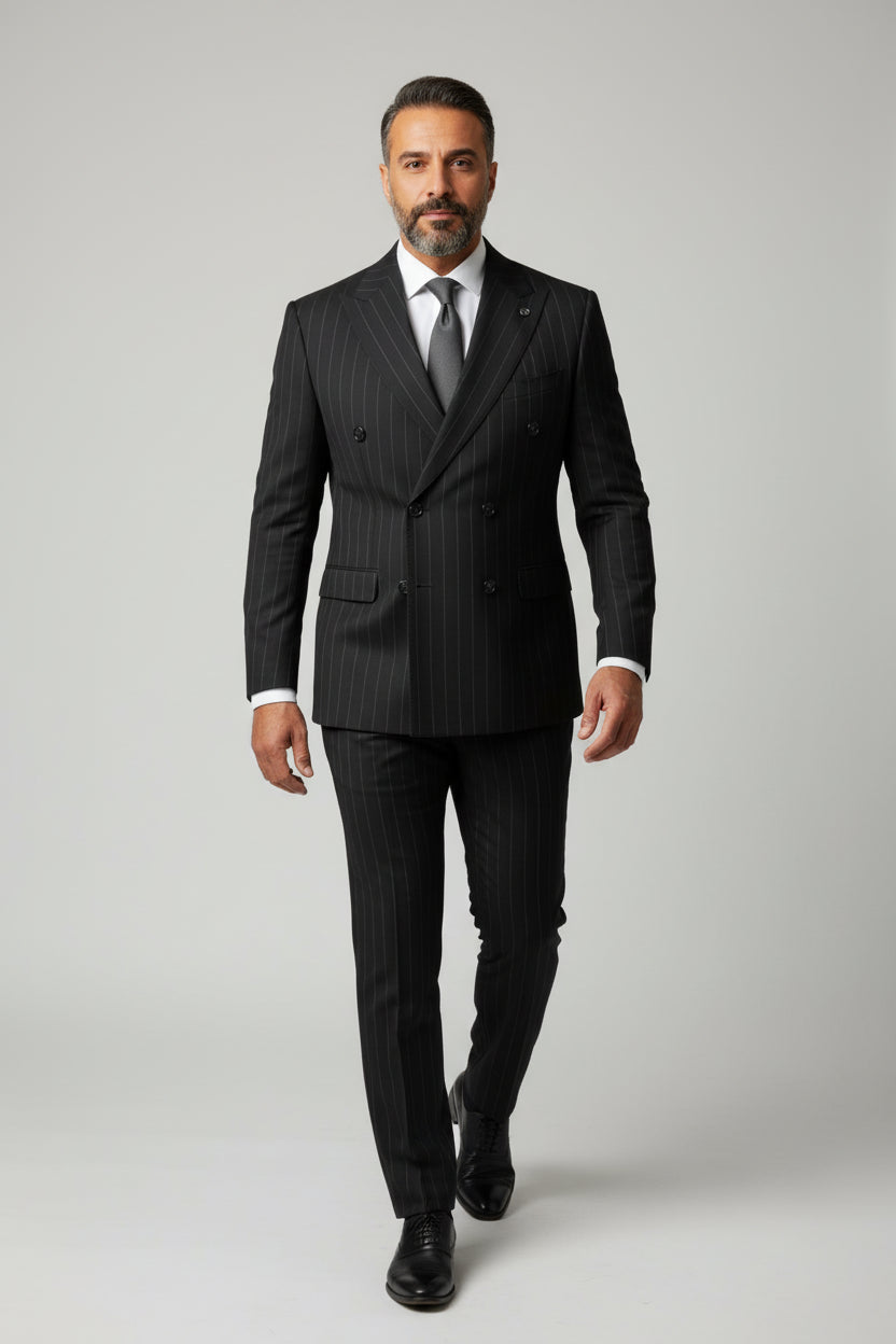 Man wearing black pinstripe double-breasted suit with tailored fit and elegant style.