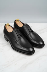 Black leather lace-up dress shoes with classic style and textured finish.
