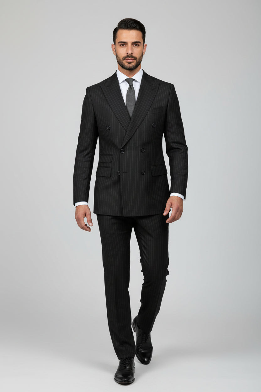 Man wearing black pinstripe double-breasted suit, tailored for formal occasions.