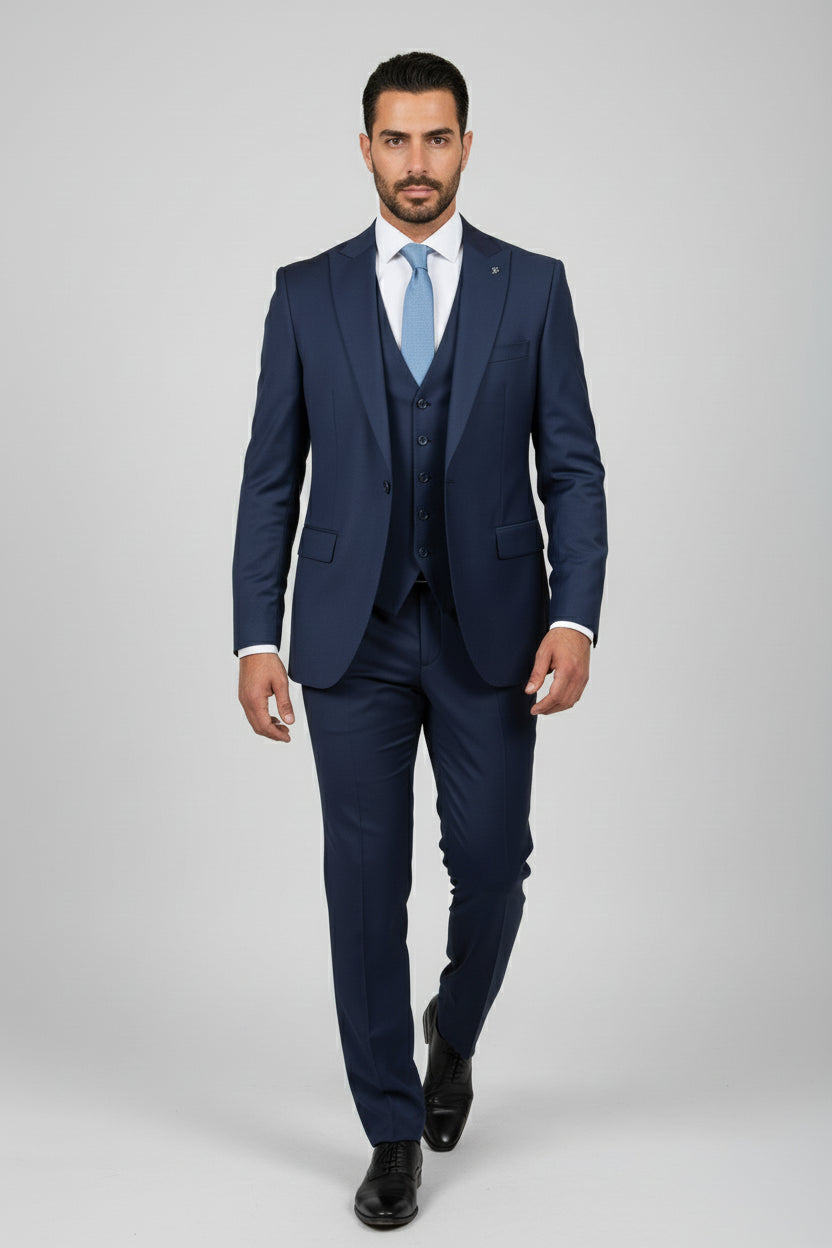 Man wearing tailored black suit with satin lapels, ideal for formal events.