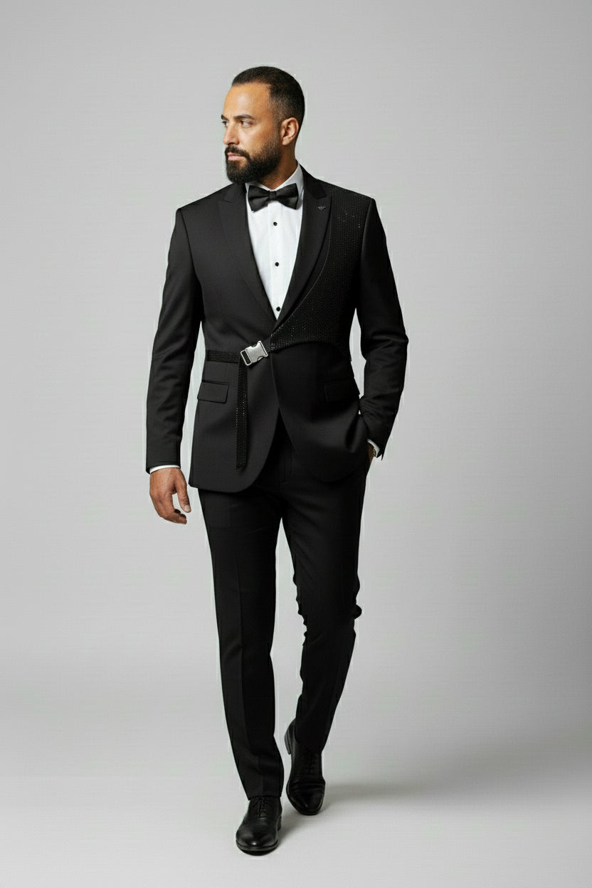 Man wearing black slim fit suit with sequin detail and bow tie.