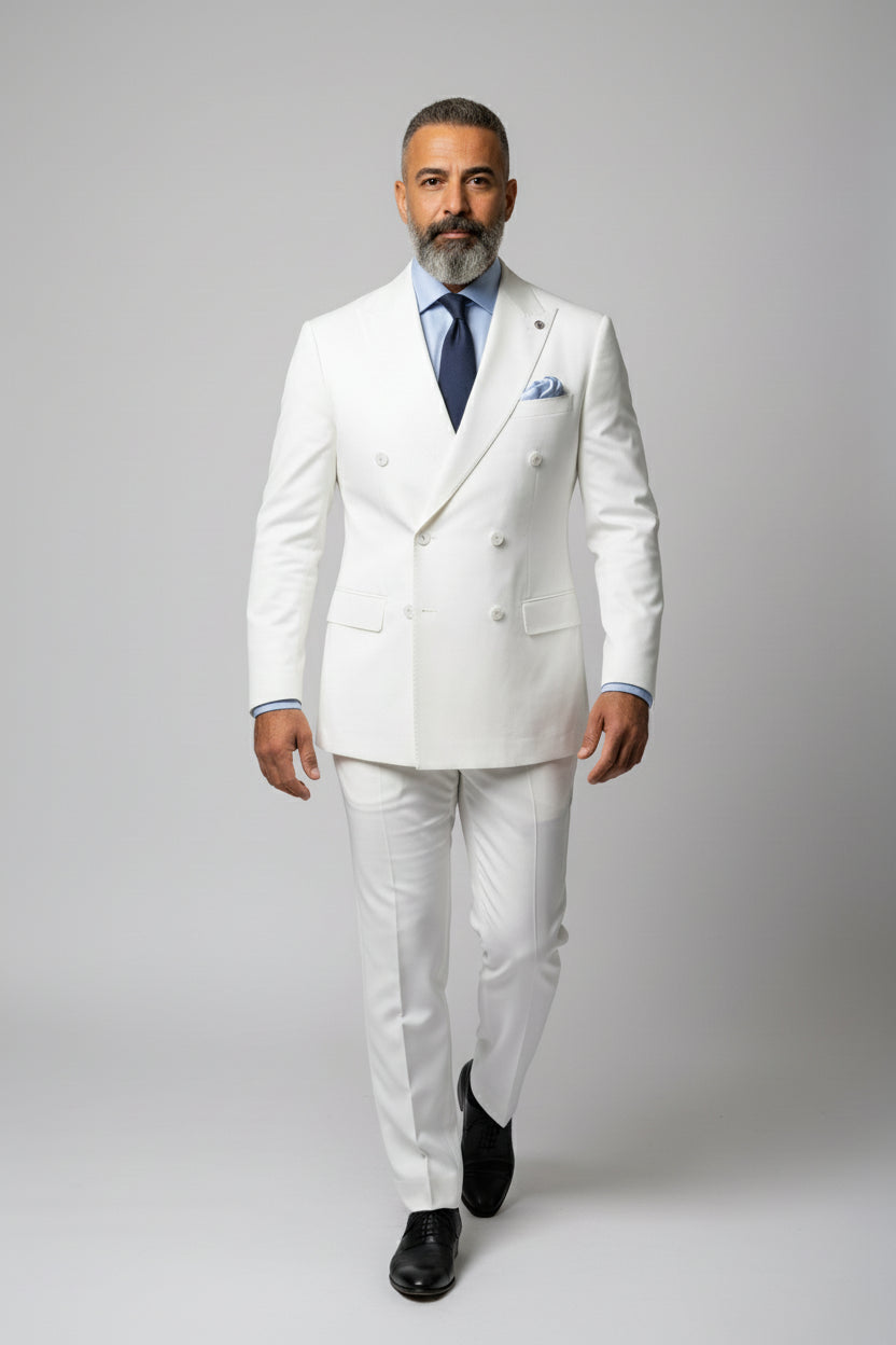 Man wearing a tailored white double-breasted dinner suit with peak lapels.
