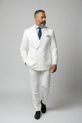 Man in white double-breasted dinner suit with peak lapels and tailored fit.