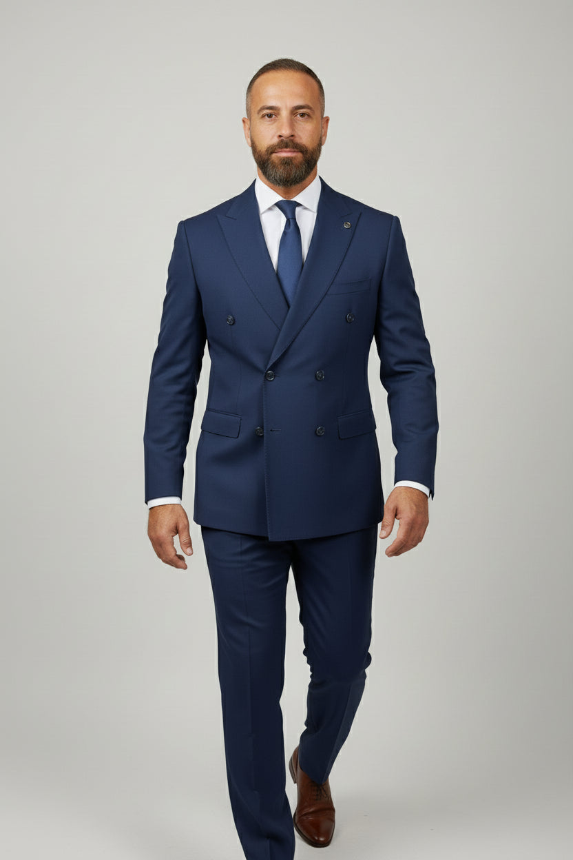 Man wearing a navy double-breasted suit with tailored fit and elegant design.