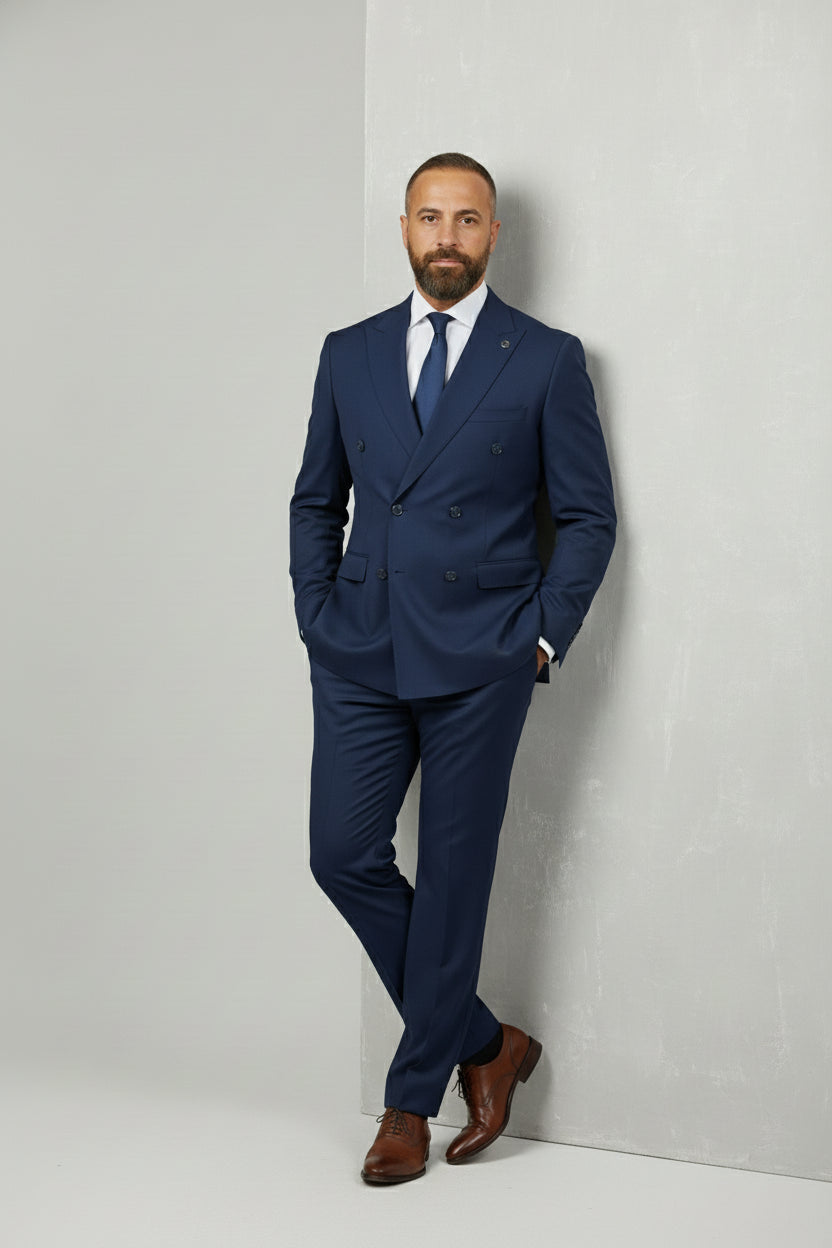 Man wearing navy double-breasted suit with tailored fit, ideal for formal events.