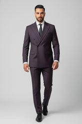 Man wearing maroon pinstripe double-breasted suit with tailored fit and tie.