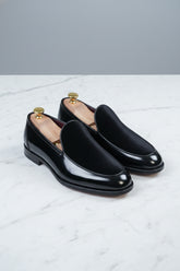 Black velvet slip-on tuxedo shoes with elegant design, perfect for formal wear events.