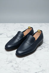 Midnight blue leather loafers with textured finish, perfect for business casual wear.