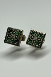 Green enamel square cufflinks featuring intricate silver detailing, ideal for formal wear.