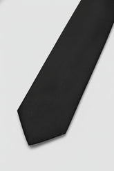 Navy textured silk tie with a classic design, perfect for formal occasions.