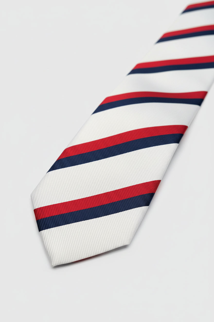 White striped silk tie featuring red and navy blue stripes, perfect for formal wear.