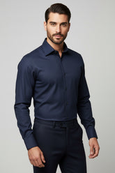 Man wearing navy slim fit striped dress shirt with button-down collar.