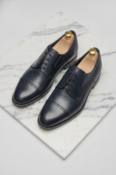Midnight blue leather Oxford shoes with lace-up design - Suit Sartoria UAE