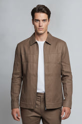 Man wearing chocolate brown safari suit with zipper front - Suit Sartoria UAE