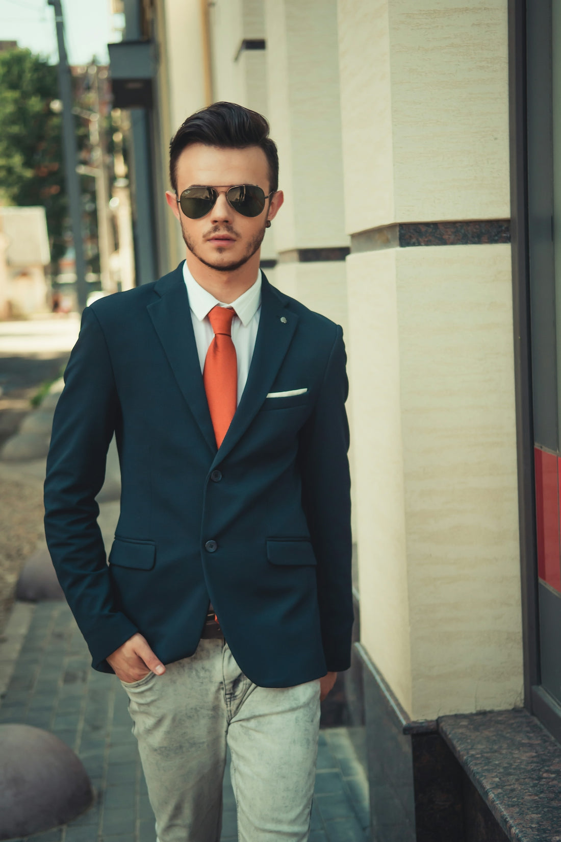 man in black suit jacket wearing black sunglasses