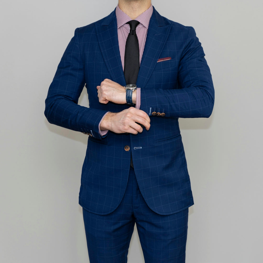 man in blue suit standing