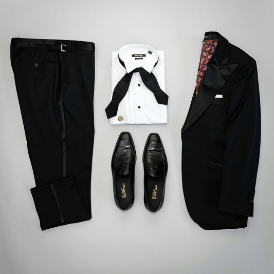 black leather boots on white surface