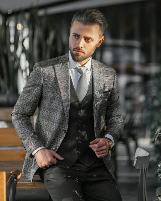 a man in a suit sitting on a bench