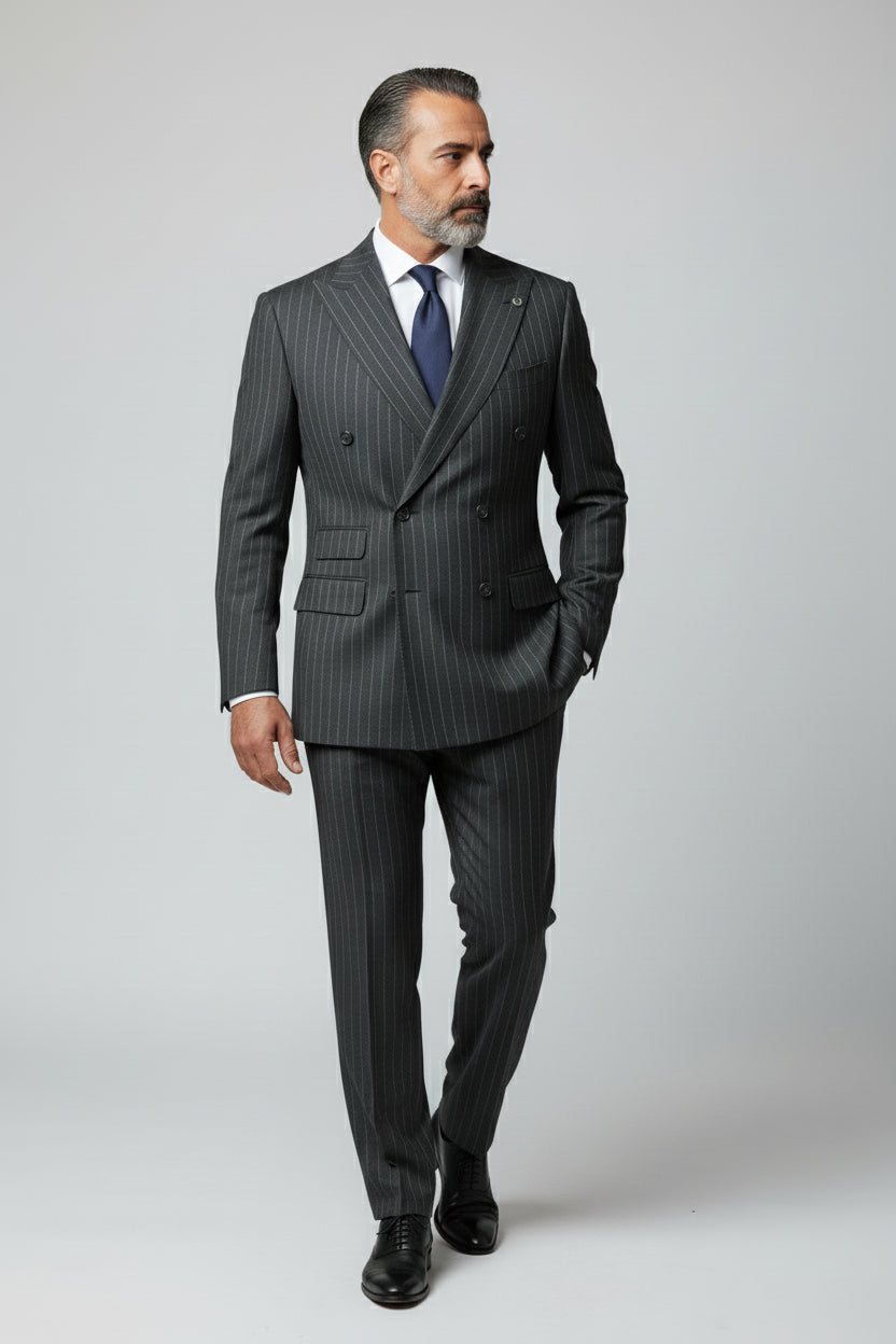 Man wearing green pinstripe double-breasted suit with tailored fit and dress shoes.