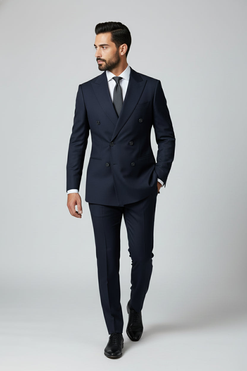 Man wearing navy double-breasted slim-fit suit for formal occasions.