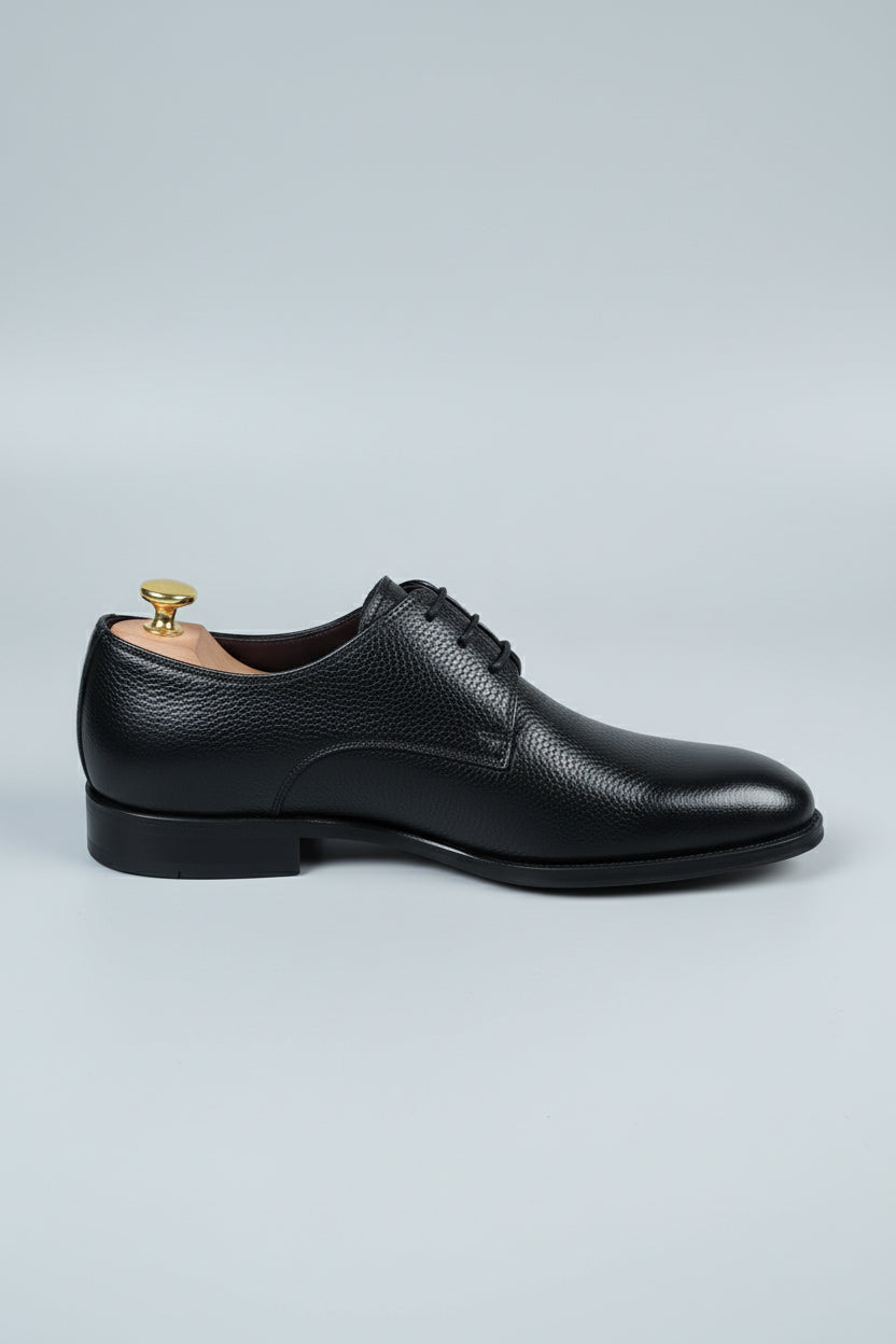Black leather lace-up dress shoes with a classic design for formal occasions.