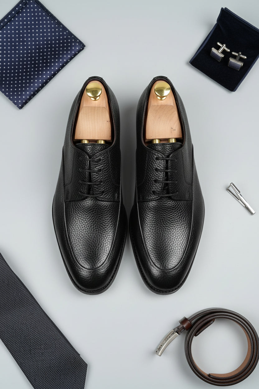 Black leather lace-up dress shoes with classic design and elegant texture.