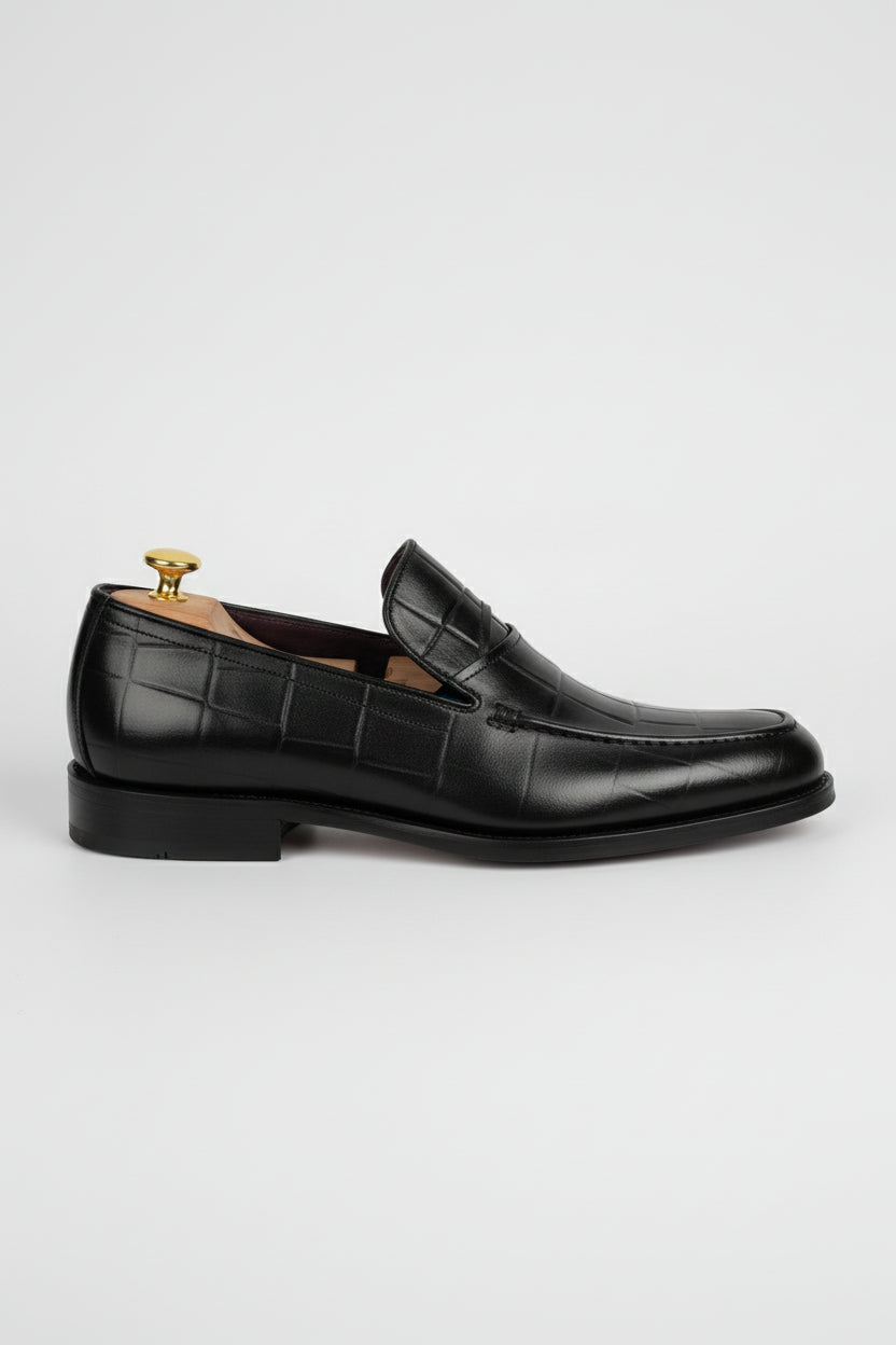 Black leather textured formal loafers with elegant design for business and weddings.