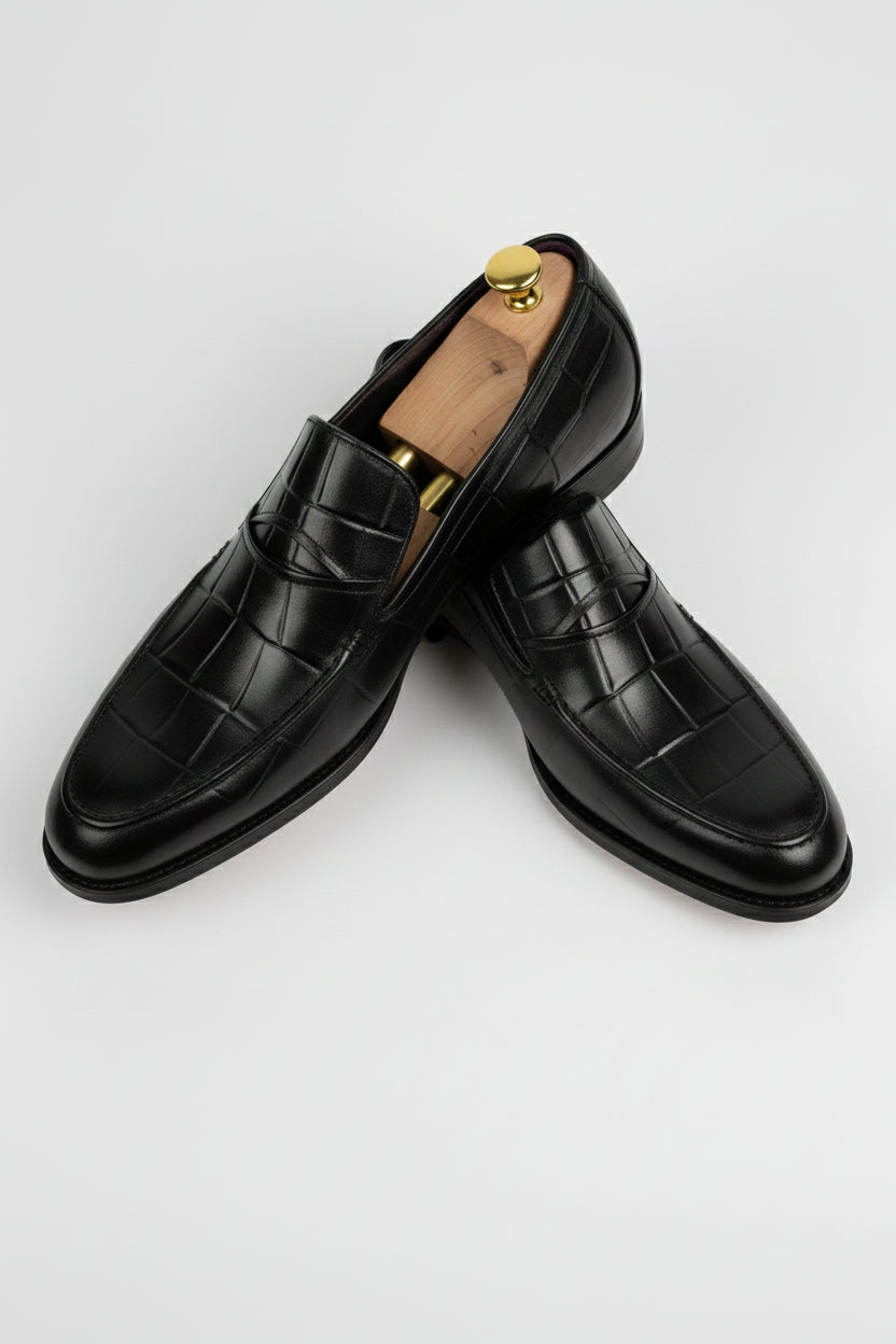 Black leather textured formal loafers with stylish design, perfect for weddings and business.