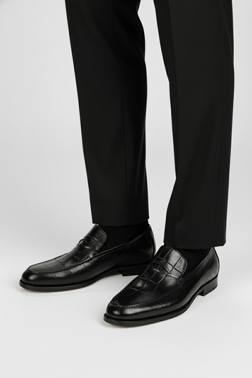 Black leather textured formal shoes with loafers design, ideal for business or weddings.