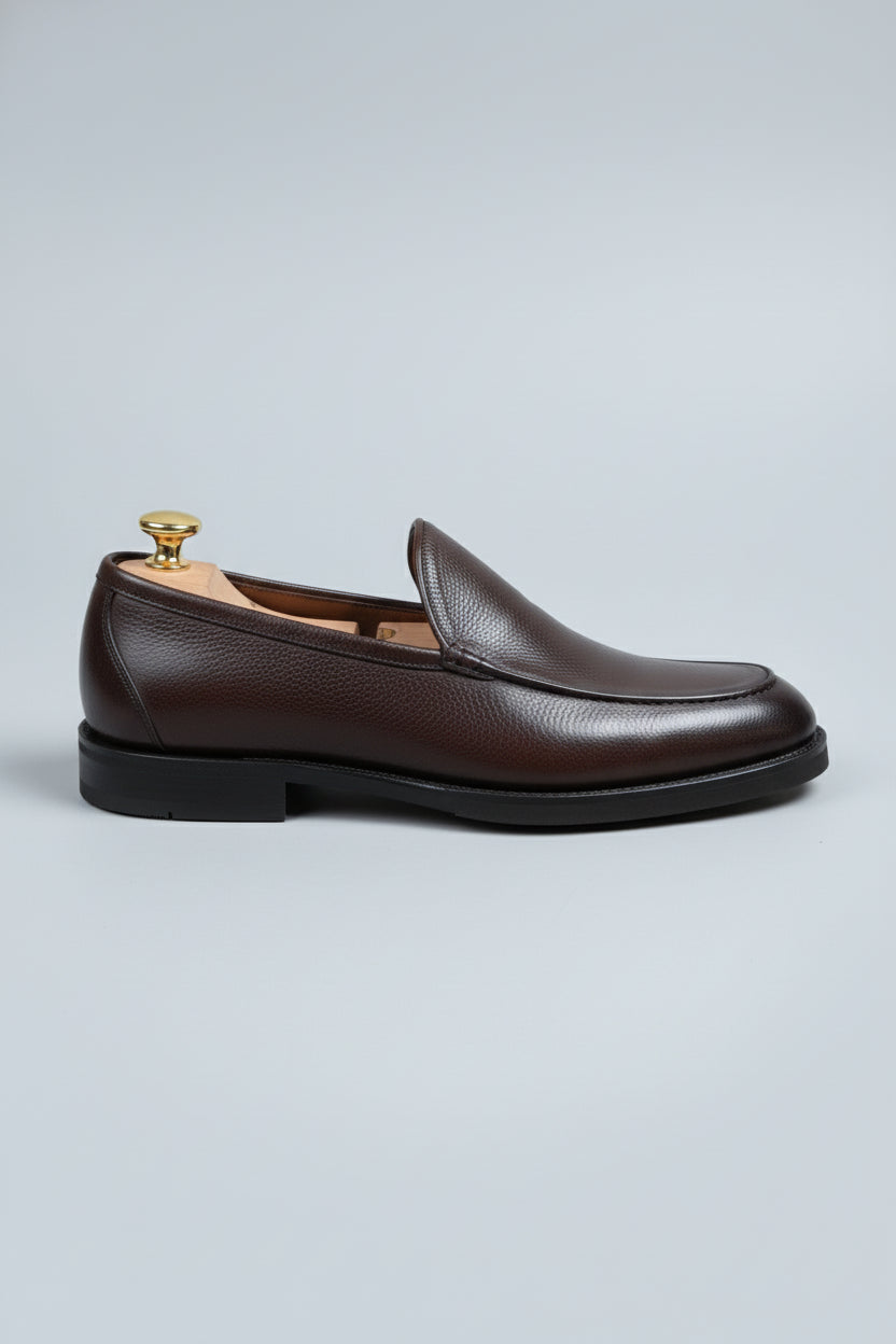 Brown slip-on leather formal shoes with a classic style for business attire.