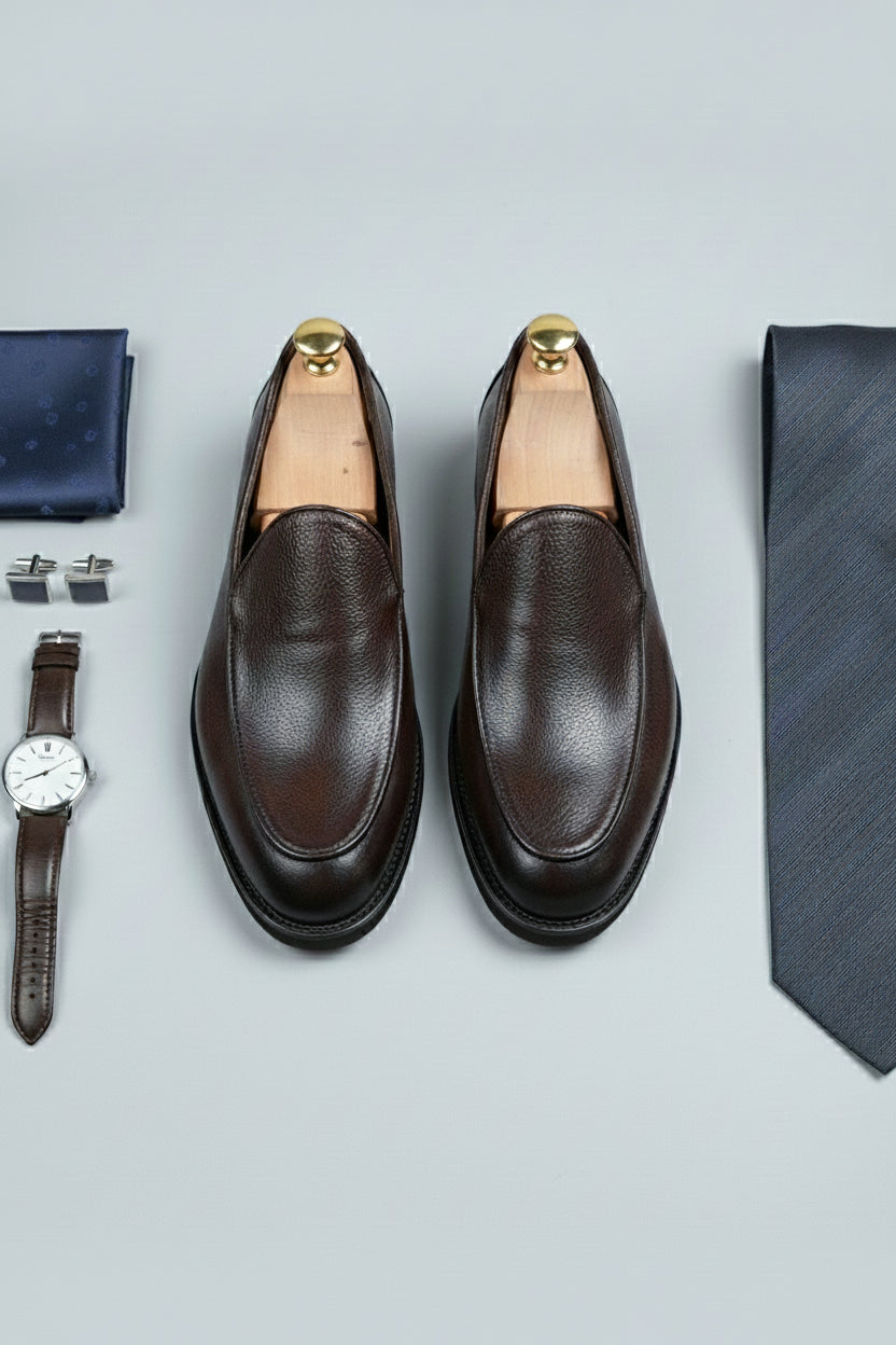 Brown slip-on leather formal shoes for business attire and elegant occasions.