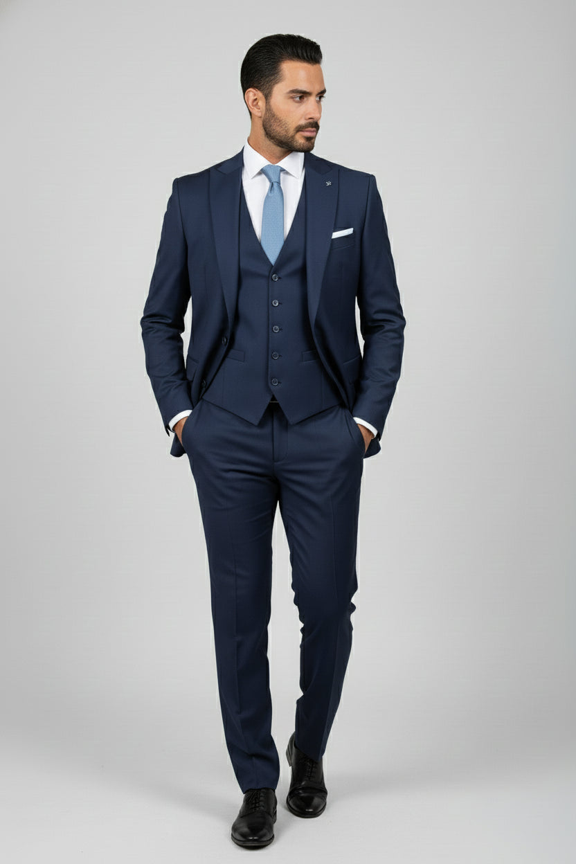 Man wearing black tailored suit with satin lapels, perfect for weddings or galas.