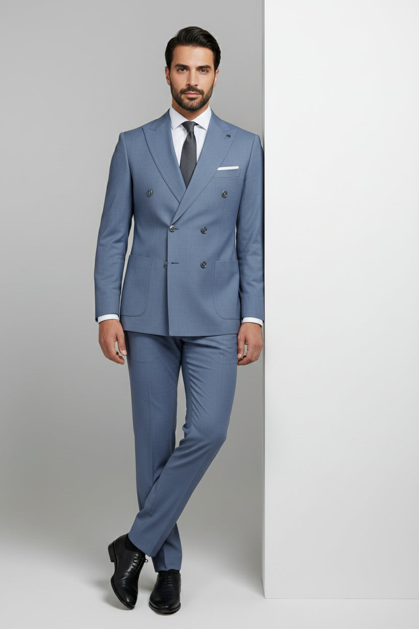Man wearing light blue double-breasted suit with tailored fit, ideal for weddings and events.