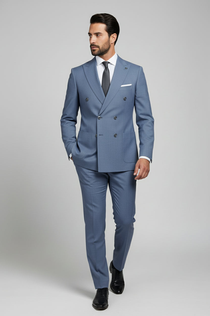 Man in light blue double-breasted suit with tailored fit for formal events.