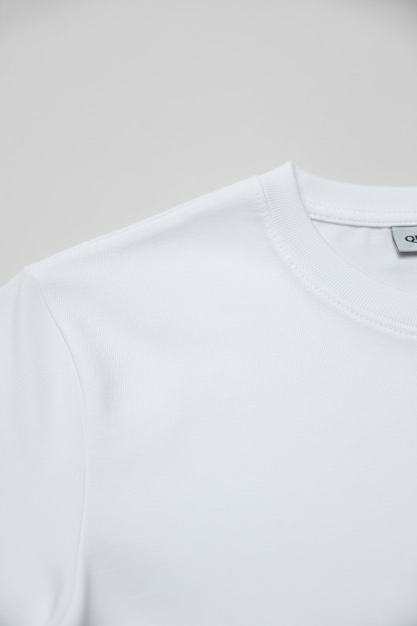 Close-up of white premium cotton t-shirt with a comfortable regular fit.