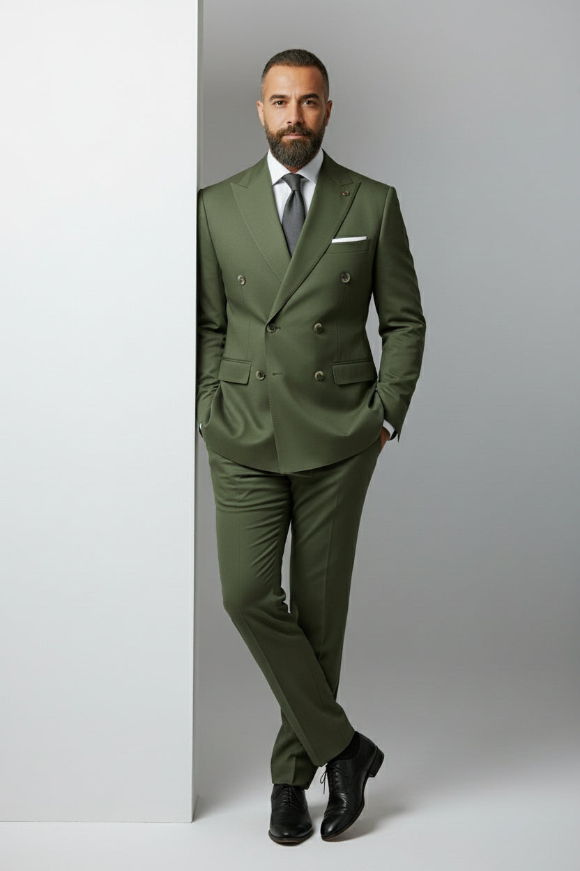 Man wearing olive double-breasted suit with peak lapels, tailored fit for formal events.