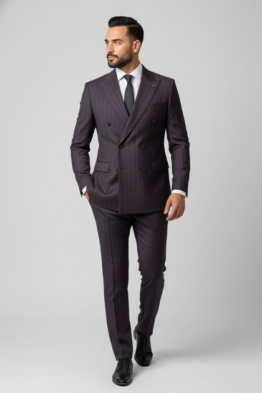 Man wearing maroon pinstripe double-breasted suit with tailored fit and black tie.