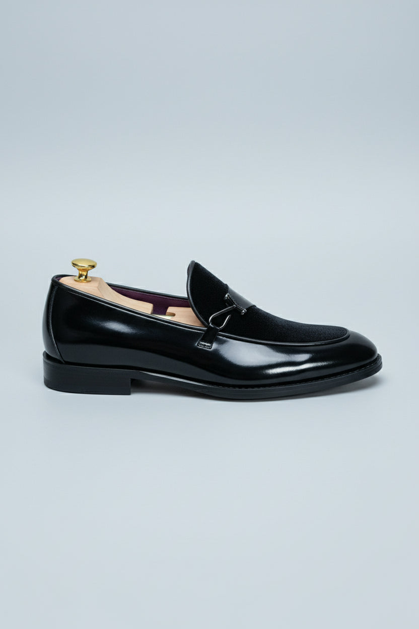 Black velvet loafer with elegant buckle, perfect for formal events and weddings.