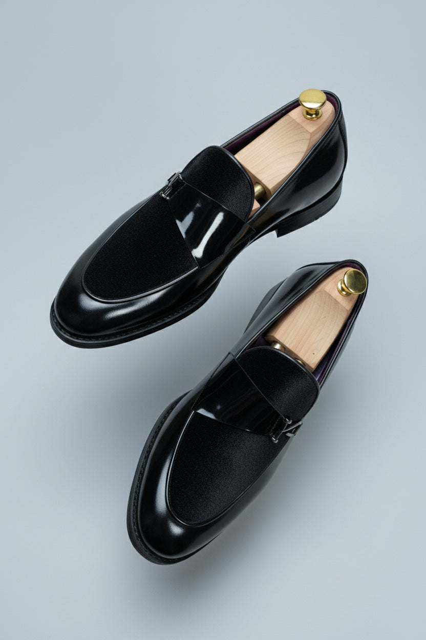 Black velvet loafer with elegant buckle, perfect for formal wear and weddings.
