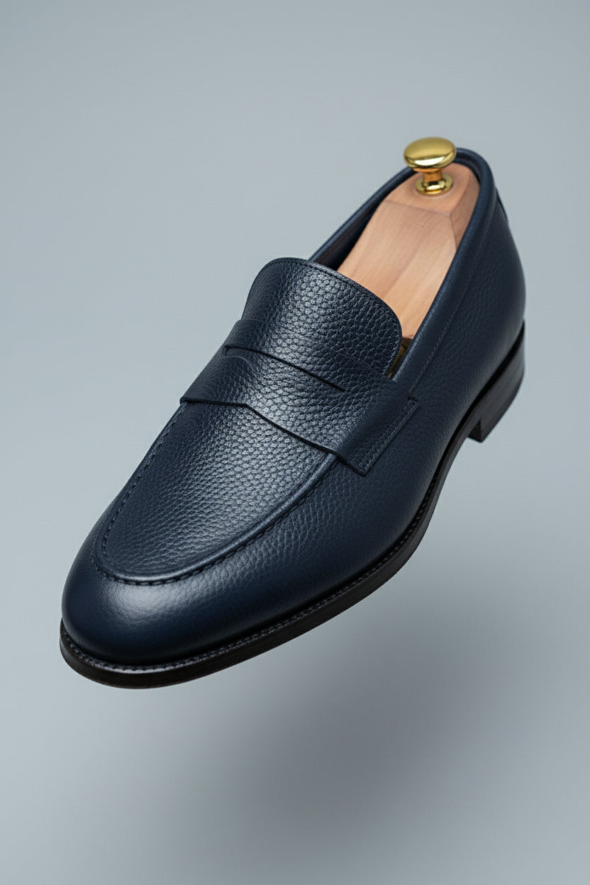 Midnight blue leather loafer with textured finish, perfect for business casual wear.