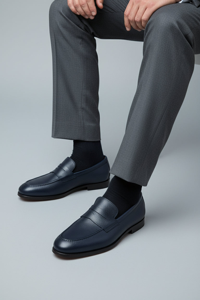 Midnight blue leather loafer with textured finish, perfect for business casual wear.