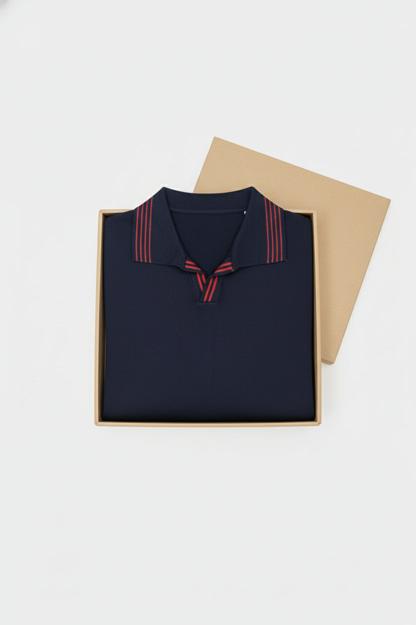Navy knit polo shirt with red striped collar, perfect for casual weekend wear.