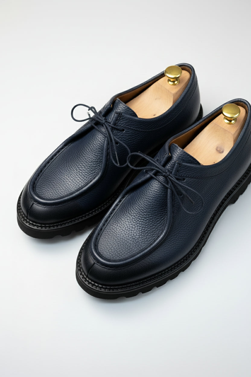 Navy leather lace-up casual shoes with rubber sole and textured finish.