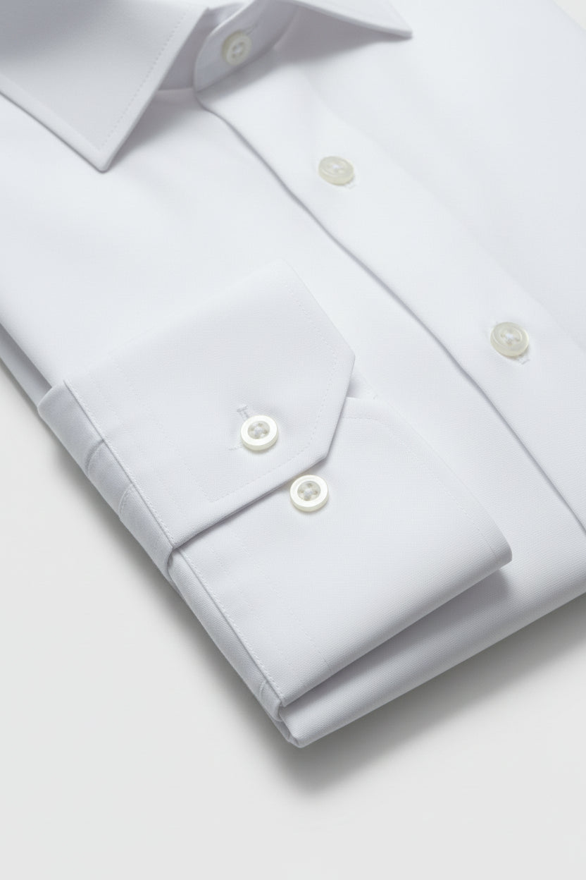 Classic white dress shirt with slim fit and buttoned cuffs.