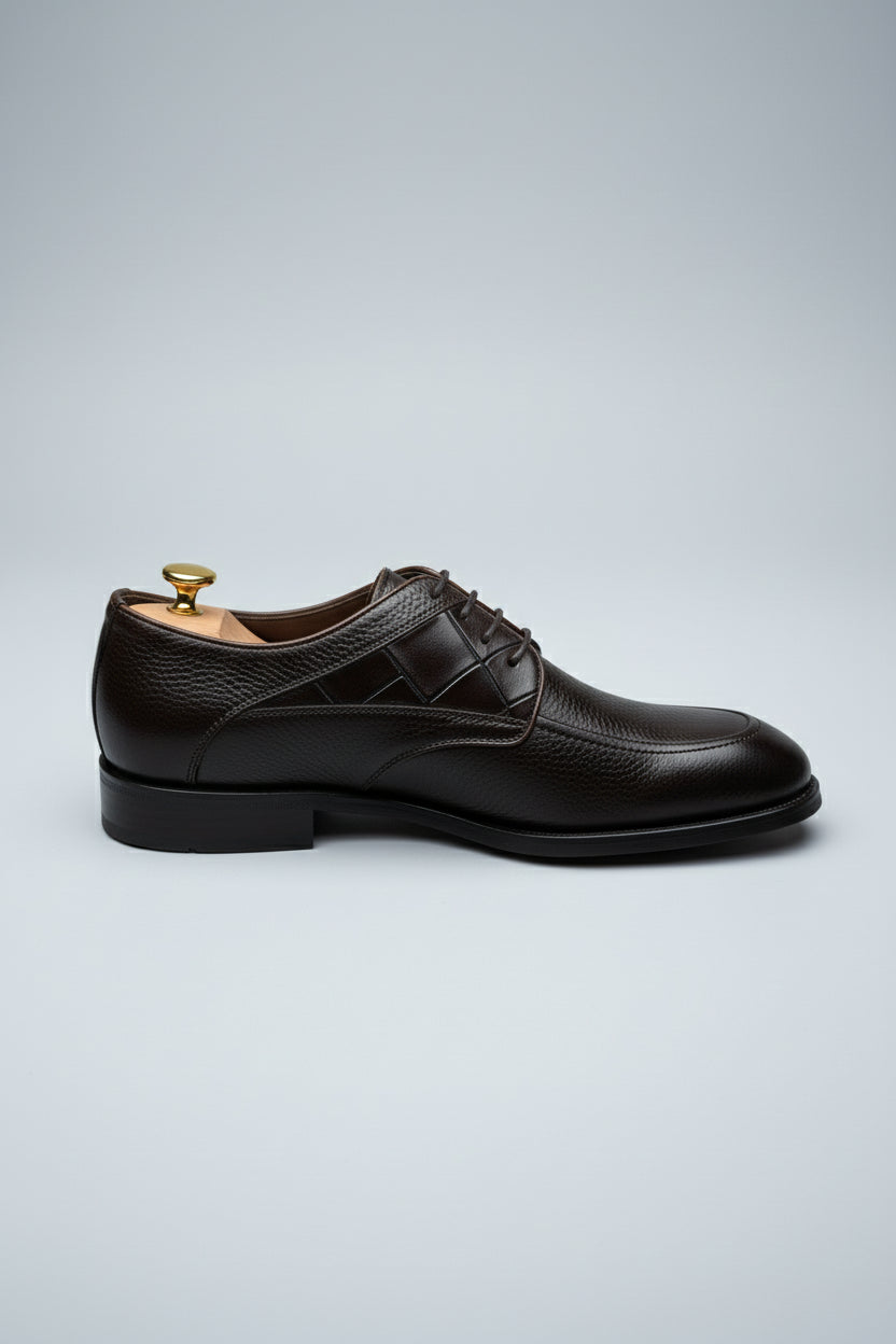 Brown leather lace-up dress shoes with a classic style for formal occasions.