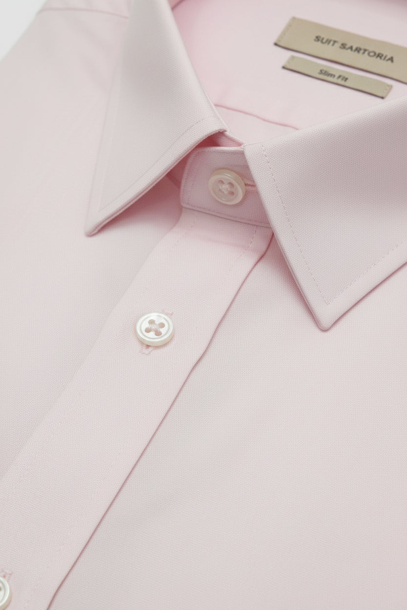 Pink slim fit dress shirt featuring a tailored collar and quality buttons.