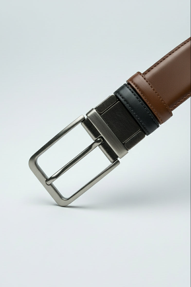 Black and brown two-tone leather belt with adjustable metallic buckle for formal and casual wear.
