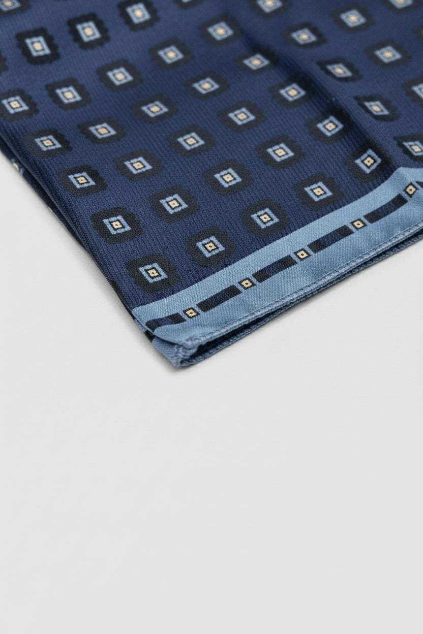 Navy geometric silk pocket square featuring elegant square patterns for formal occasions.