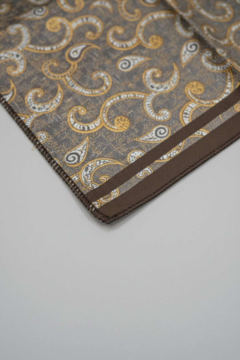 Brown paisley silk pocket square with elegant patterns for formal wear.