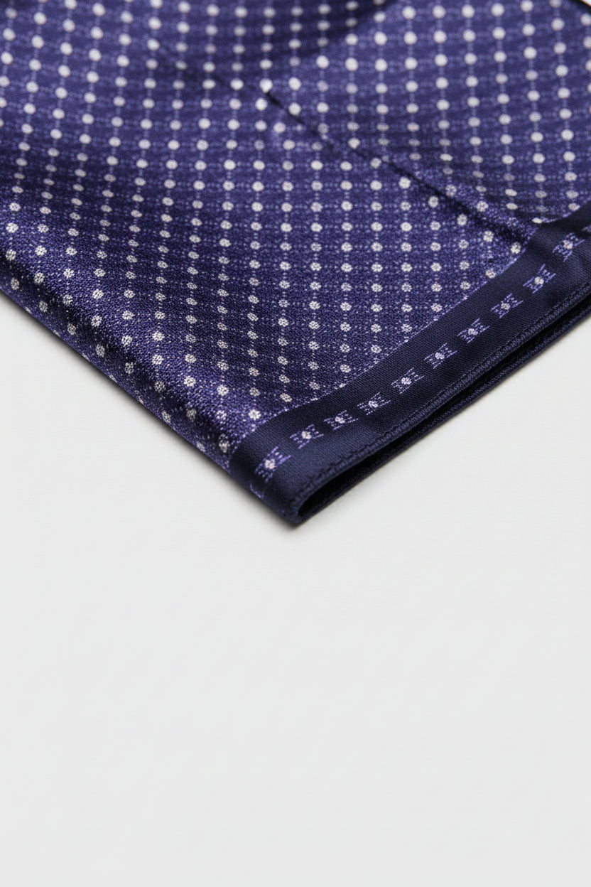 Navy silk pocket square featuring a geometric pattern, ideal for formal wear.